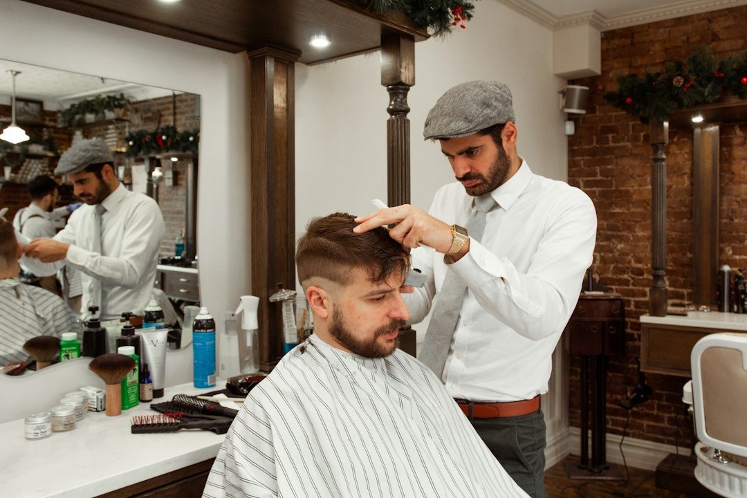 man-in-white-dress-shirt-cutting-hair-of-man-j99pg-3rhwc